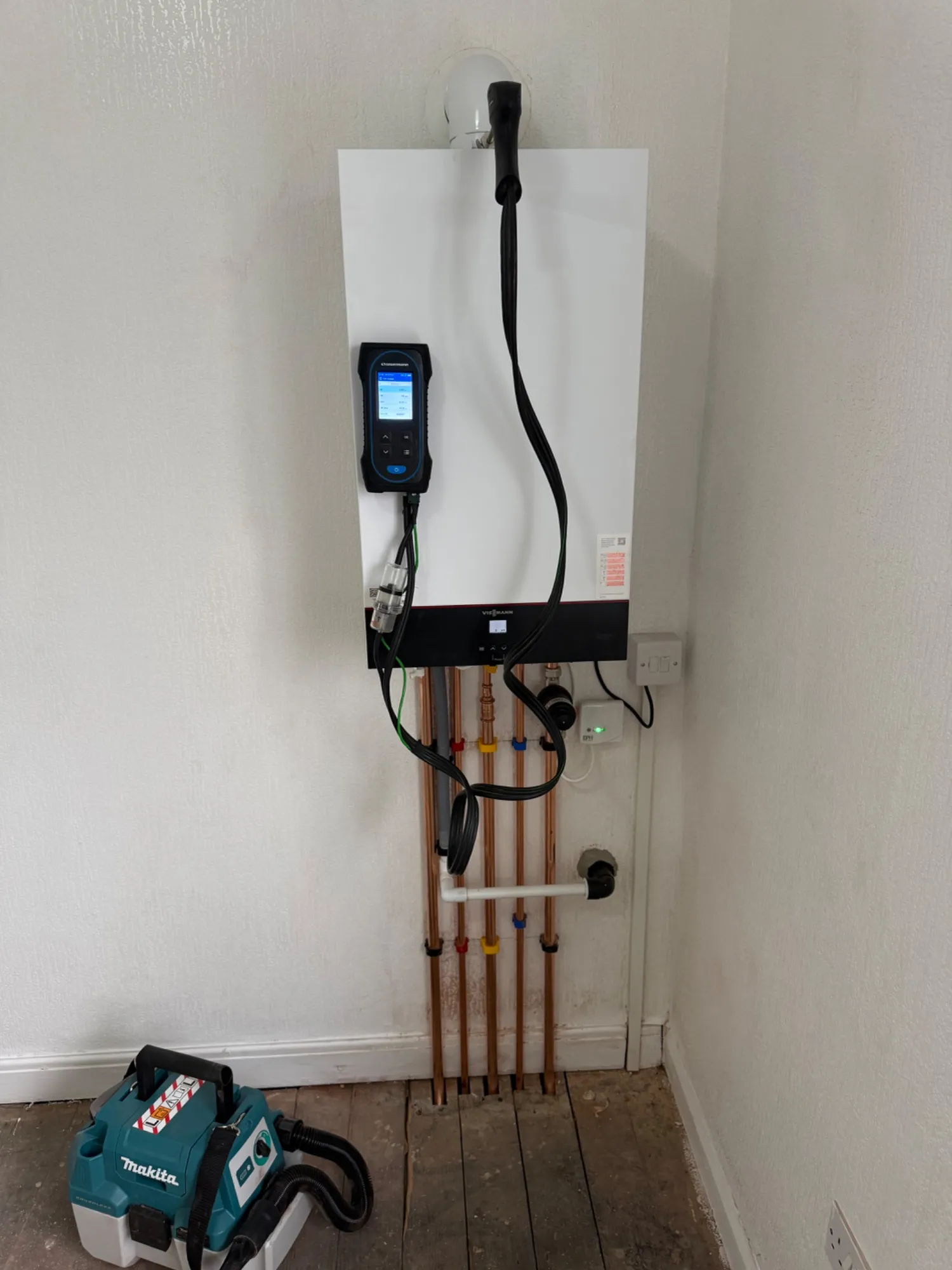 Combi boiler installation during a central heating upgrade in Nelson