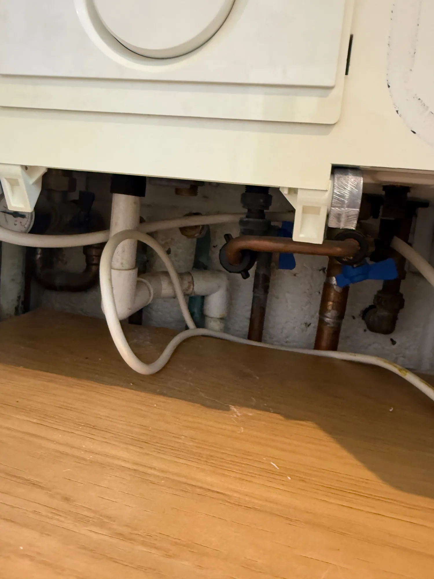 Underside of the boiler in its cupboard in Burnley