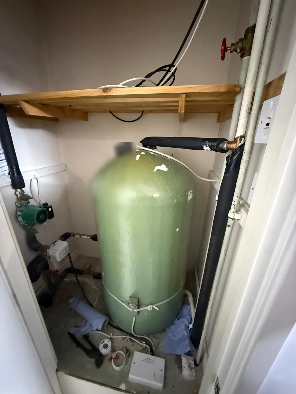 Old hot water cylinder in the cupboard before the conversion