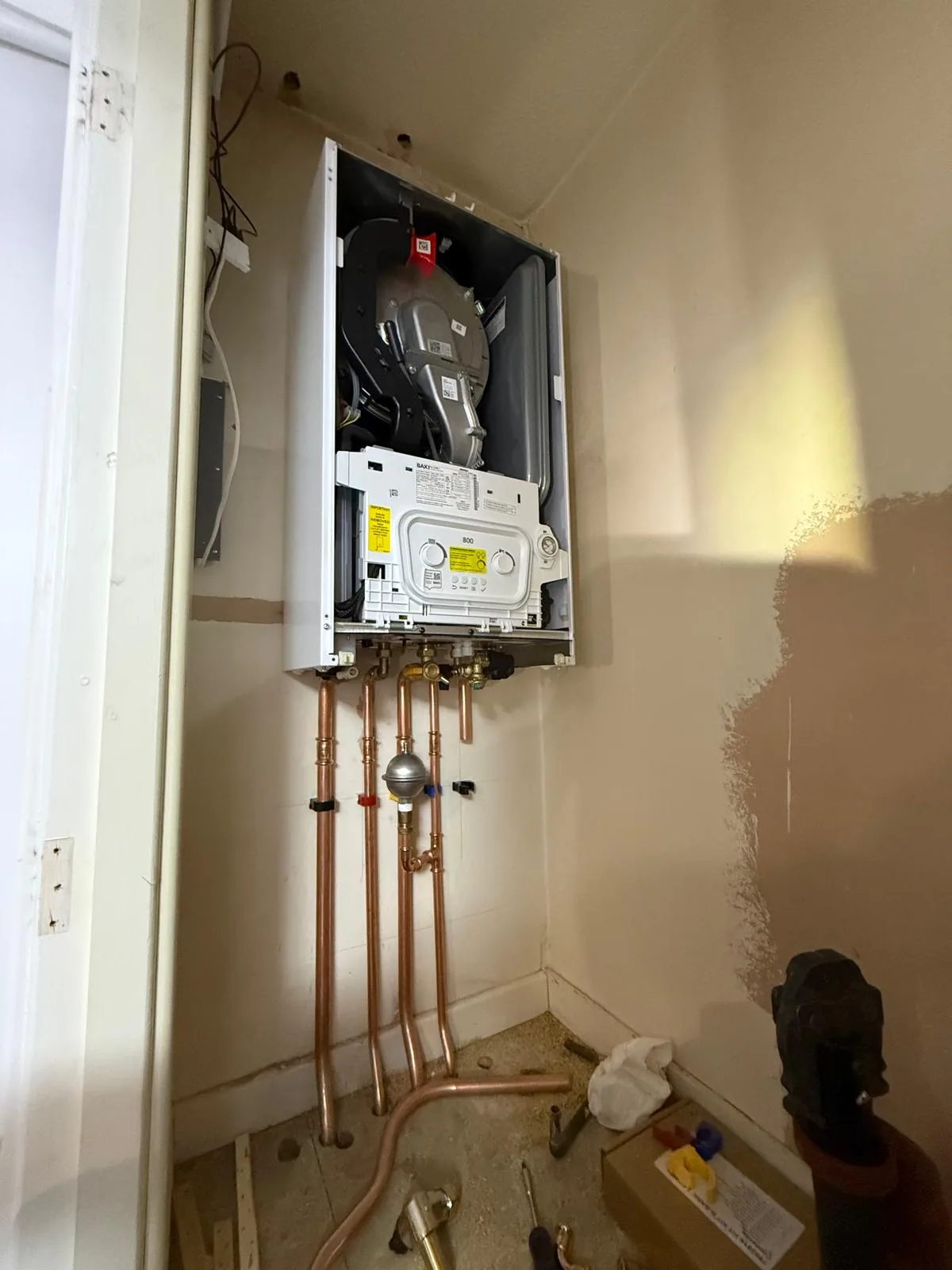 New Baxi combi being fitted in the old cylinder cupboard