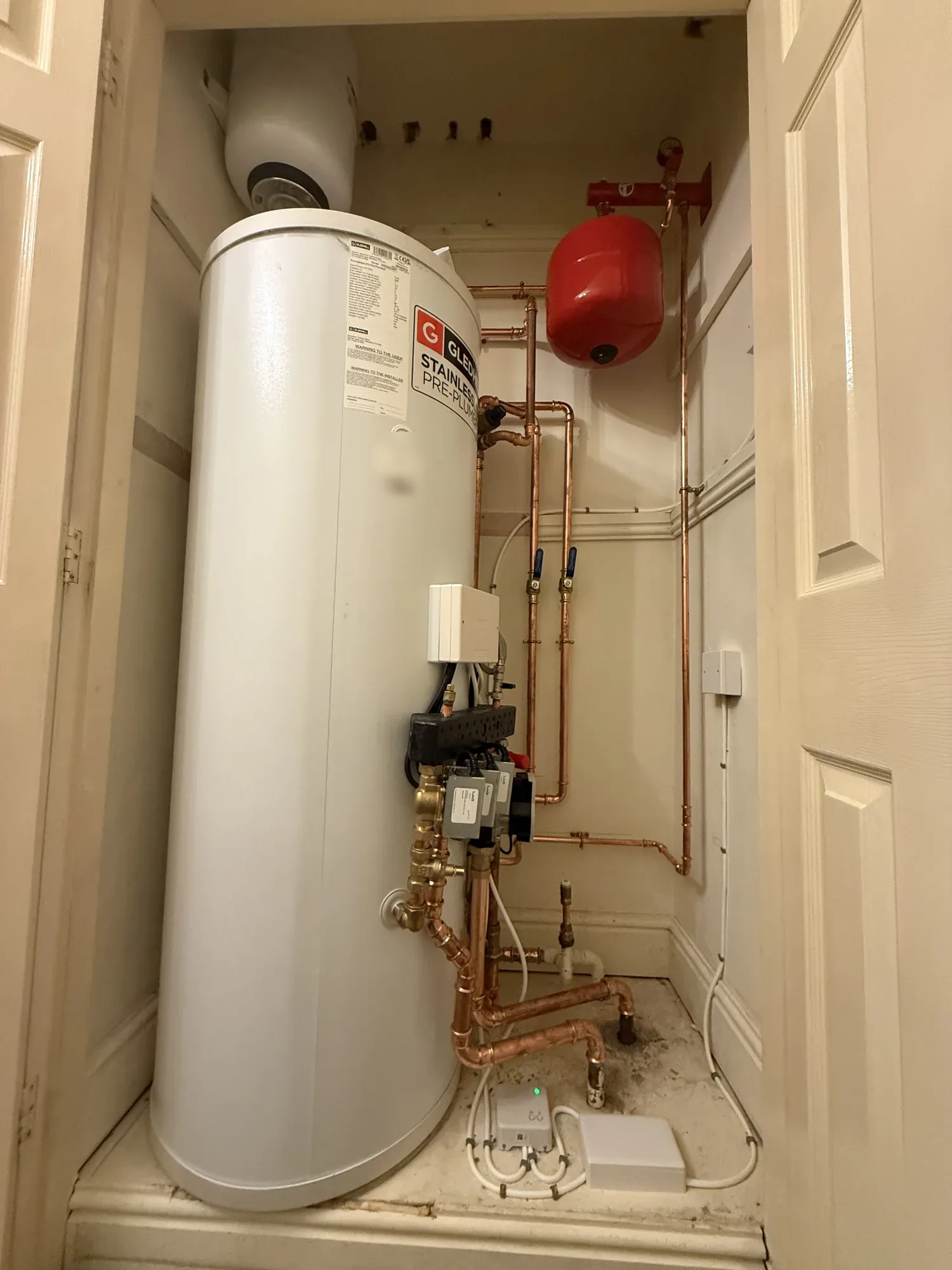Unvented hot water cylinder installed with expansion vessel and copper pipework